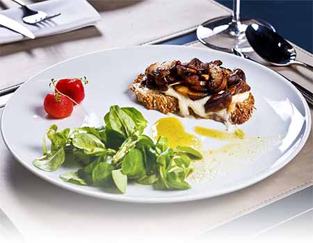 Image of a table setting with Chef-prepared food on a plate